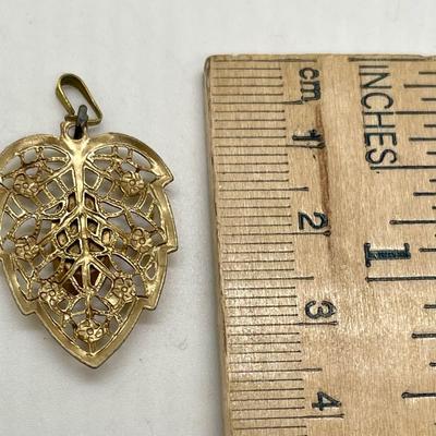 Gold leaf, pendant, or charm