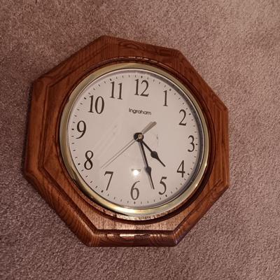 Wooden magazine rack and wood framed Ingham wall clock