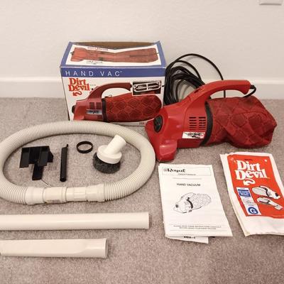 Hand Vac Dirt Devil vacuum with attachments and operator manual