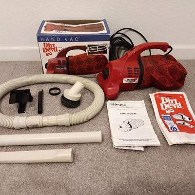 Hand Vac Dirt Devil vacuum with attachments and operator manual