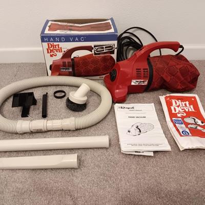 Hand Vac Dirt Devil vacuum with attachments and operator manual