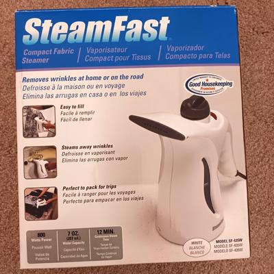 Steamfast compact fabric steamer removes wrinkles at home or on the road