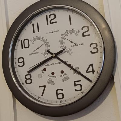 12" Howard Miller wall clock with weather station