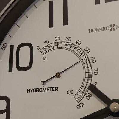 12" Howard Miller wall clock with weather station