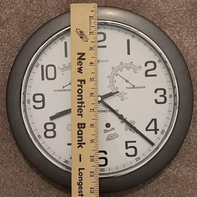 12" Howard Miller wall clock with weather station