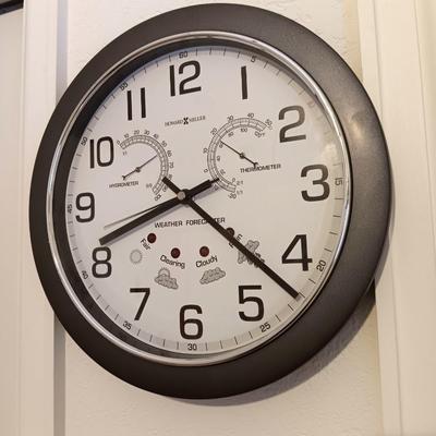 12" Howard Miller wall clock with weather station