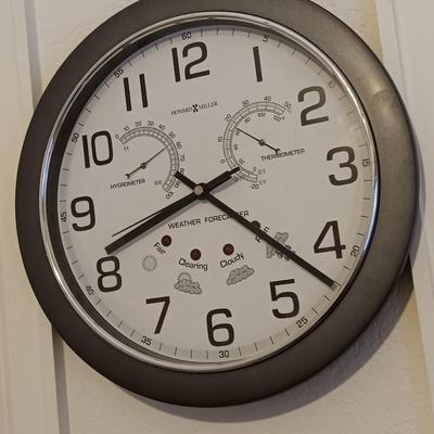 12" Howard Miller wall clock with weather station