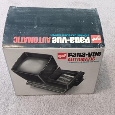 Polaroid Sun 660 Autofocus camera with original box and a Pana-Vue Automatic slide viewer