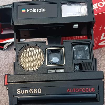 Polaroid Sun 660 Autofocus camera with original box and a Pana-Vue Automatic slide viewer
