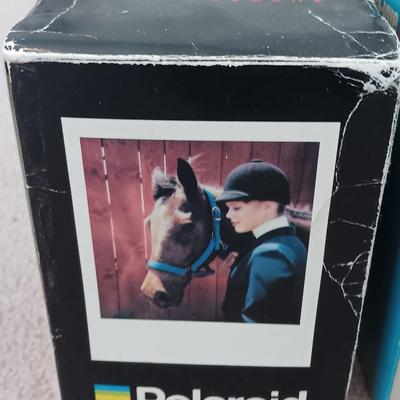 Polaroid Sun 660 Autofocus camera with original box and a Pana-Vue Automatic slide viewer