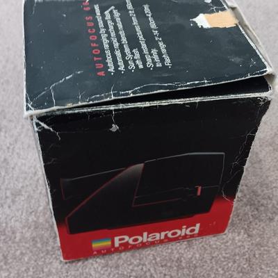 Polaroid Sun 660 Autofocus camera with original box and a Pana-Vue Automatic slide viewer