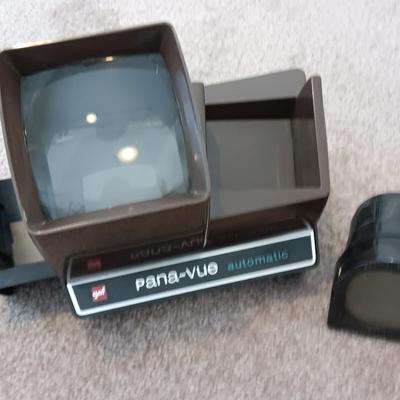 Polaroid Sun 660 Autofocus camera with original box and a Pana-Vue Automatic slide viewer