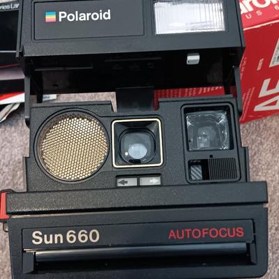 Polaroid Sun 660 Autofocus camera with original box and a Pana-Vue Automatic slide viewer