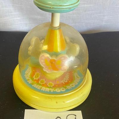 Vintage Tomy Push and Go Merry Go Round Toy