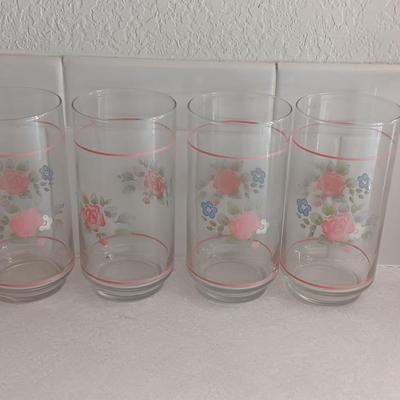 Floral pattern insulated Pheonix carafe with eight Libby pink floral drinking glasses.