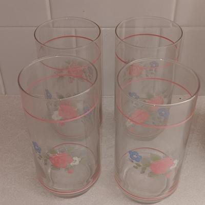 Floral pattern insulated Pheonix carafe with eight Libby pink floral drinking glasses.