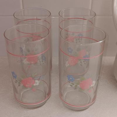 Floral pattern insulated Pheonix carafe with eight Libby pink floral drinking glasses.