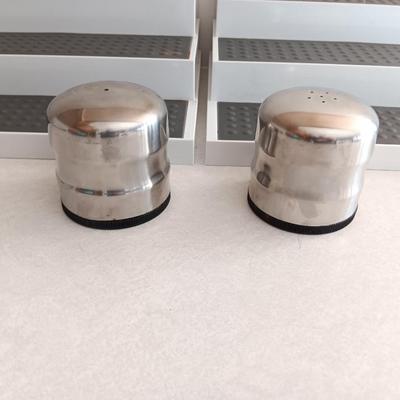 Two cupboard organizing platforms for spices and metal salt & pepper shakers