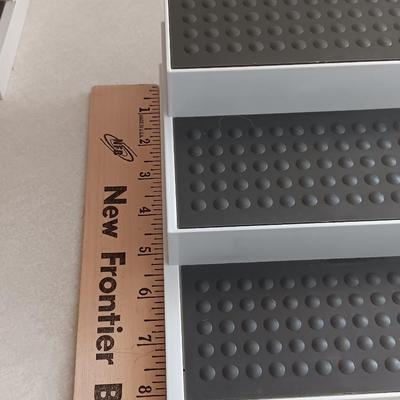 Two cupboard organizing platforms for spices and metal salt & pepper shakers