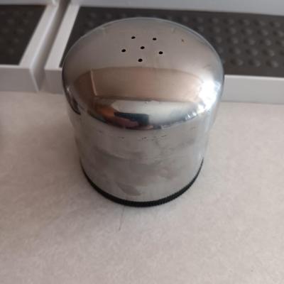 Two cupboard organizing platforms for spices and metal salt & pepper shakers