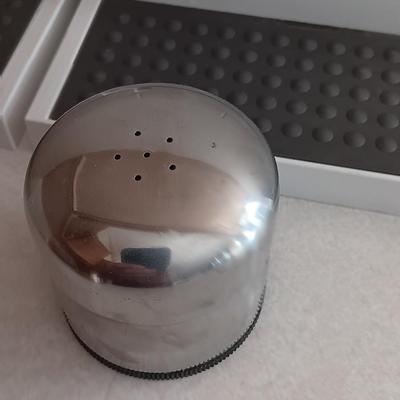 Two cupboard organizing platforms for spices and metal salt & pepper shakers