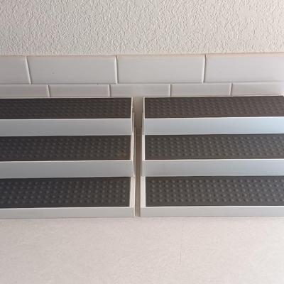 Two cupboard organizing platforms for spices and metal salt & pepper shakers