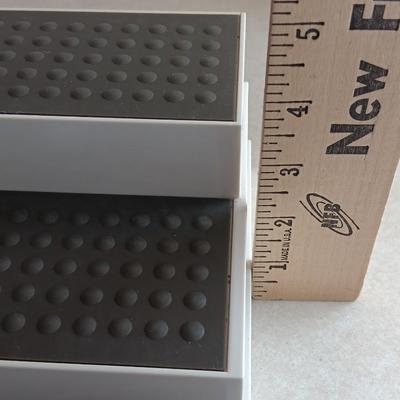 Two cupboard organizing platforms for spices and metal salt & pepper shakers