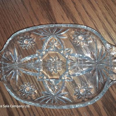 Pink depression glass with two divided pressed glass dishes and a rose patterned dish