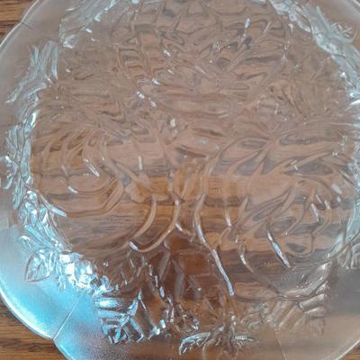 Pink depression glass with two divided pressed glass dishes and a rose patterned dish