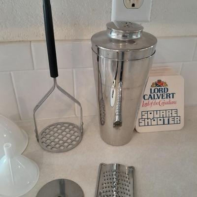 Kitchen Utensils -pizza cutter - garlic grinder - scissors - masher - drink mixing cup and more