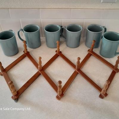 Six matching Corning Mugs with wooden wall hung mug holder.