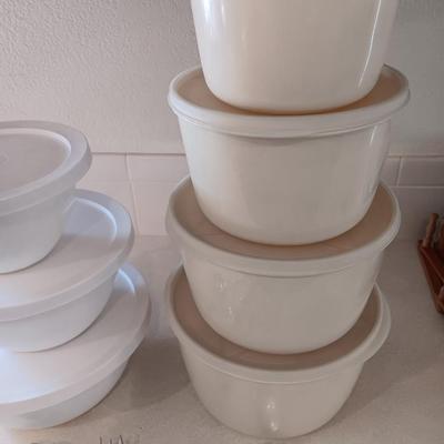 Two sets of plastic food storage containers - nesting - with lids - and serving utensils
