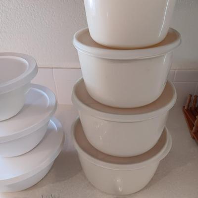 Two sets of plastic food storage containers - nesting - with lids - and serving utensils