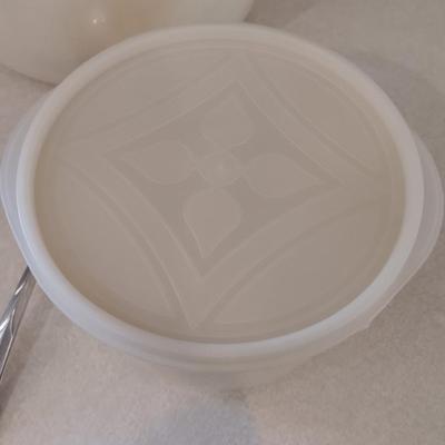 Two sets of plastic food storage containers - nesting - with lids - and serving utensils
