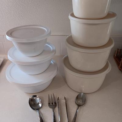 Two sets of plastic food storage containers - nesting - with lids - and serving utensils