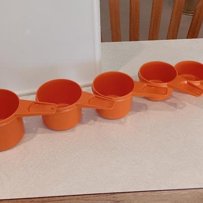 Tupperware - measuring cups - large food storage container - divided dish with dip dish and more.