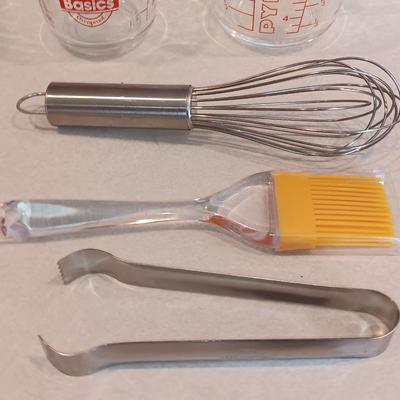 Two glass measuring cups - kitchen utensils - flour sifter