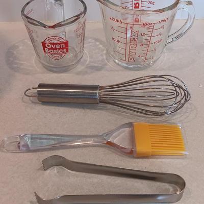 Two glass measuring cups - kitchen utensils - flour sifter