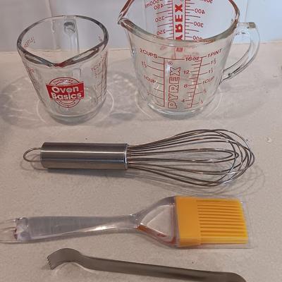 Two glass measuring cups - kitchen utensils - flour sifter