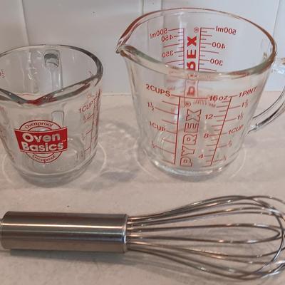 Two glass measuring cups - kitchen utensils - flour sifter