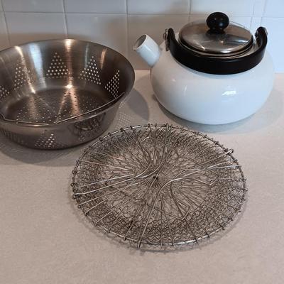 White tea kettle with strainer pan and strainer insert.