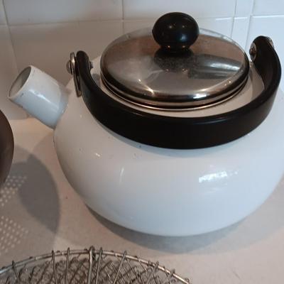 White tea kettle with strainer pan and strainer insert.