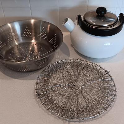 White tea kettle with strainer pan and strainer insert.