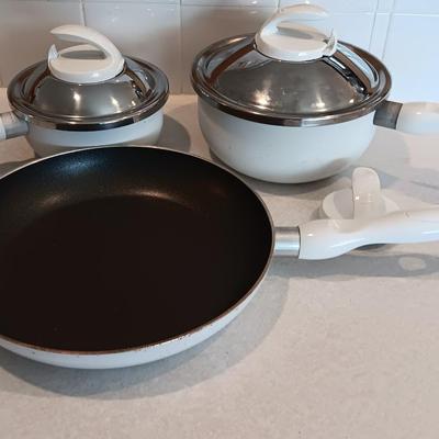 White T-fal cookware Skillet and saucepans