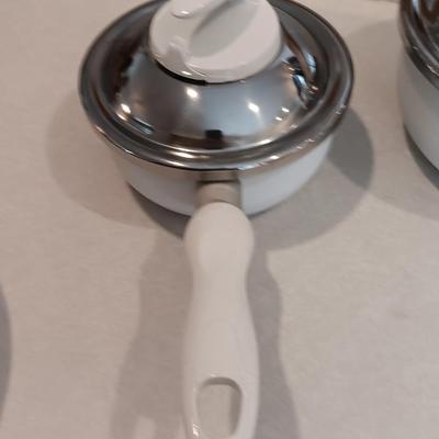 White T-fal cookware Skillet and saucepans