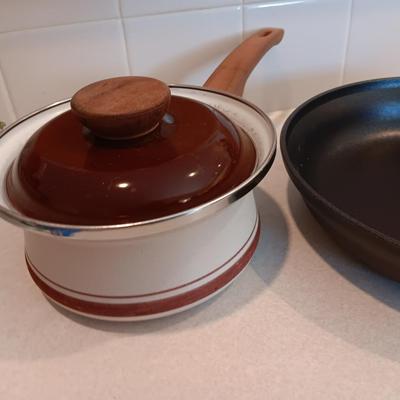 Kitchen cookware - skillets and a sauce pan with lid
