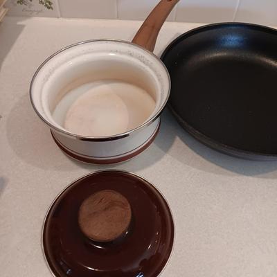 Kitchen cookware - skillets and a sauce pan with lid