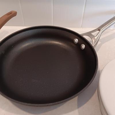Kitchen cookware - skillets and a sauce pan with lid