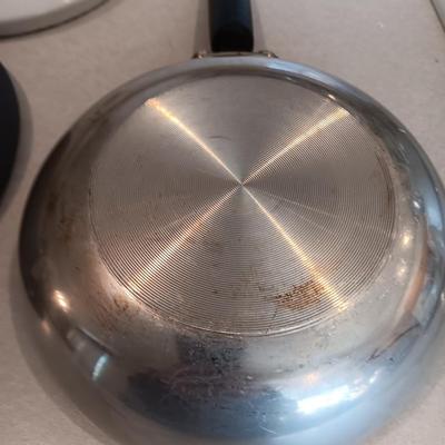 Kitchen cookware - skillets and a sauce pan with lid