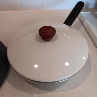 Kitchen cookware - skillets and a sauce pan with lid
